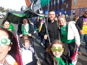 Family enjoying the Manchester St Patrick’s Day Parade 2023